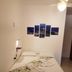 Hope Pousada in Arraial do Cabo: simple double bed with folded towels, wall art, and ceiling fan