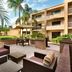 Courtyard by Marriott Fort Myers Cape Coral courtyard seating area with palm trees and outdoor patio