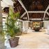 Maradiva Villas Resort & Spa in Flic en Flac, airy lobby with palm plants and high timber roof