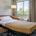 Fairfield Inn by Marriott Portsmouth Seacoast guest room with sofa bed and window view