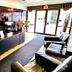 The Medicine Hat Villa lobby with front desk, seating area, and glass entrance in Medicine Hat