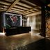 Hotel Vin, Grapevine, Autograph Collection lobby with illuminated V logo, wood ceiling beams and reception desk