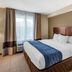 Comfort Inn & Suites Virginia Beach - Norfolk Airport guest room with king bed and window