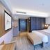 Home Inn Plus Foshan Shunde Qinghui Garden Rt-Mart room with king bed and bench in Foshan