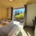 Le Cairn in Les Deux-Alpes: cozy bedroom with twin beds and balcony mountain view