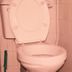 Leinmach House Nyali in Mombasa bathroom with open toilet seat and tiled walls