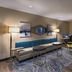 TownePlace Suites by Marriott Naples lounge with seating, work desk and large window view