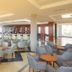 Hotel RH Vinaròs Playa lounge bar in Vinaròs with seating, tables, and a long bar area