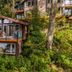 The Cabins at Terrace Beach in Ucluelet, hillside cabin with balcony surrounded by lush forest