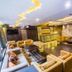 Hotel Centre Point in Nagpur lobby lounge with seating area, warm lighting and polished wood floors