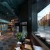 Pierdrei Hotel Hafencity Hamburg lobby with teal reception and city street view in Hamburg