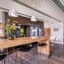 B&B HOTEL La Rochelle Centre lobby with reception desk, bar stools, lounge chairs and shop area