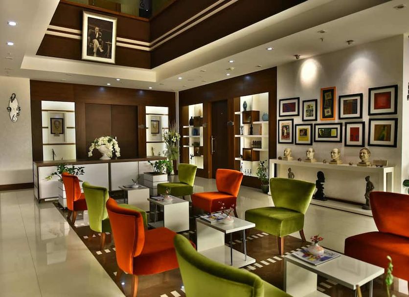 Siir Boutique Hotel in Denizli lobby lounge with colorful chairs, framed art, and polished floors