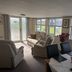 Hogwarts Bed and Continental Breakfast in Sheerness living area with large windows and sofa seating