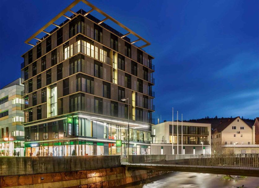 ibis Styles Nagold-Schwarzwald in Nagold, modern riverside hotel exterior at dusk