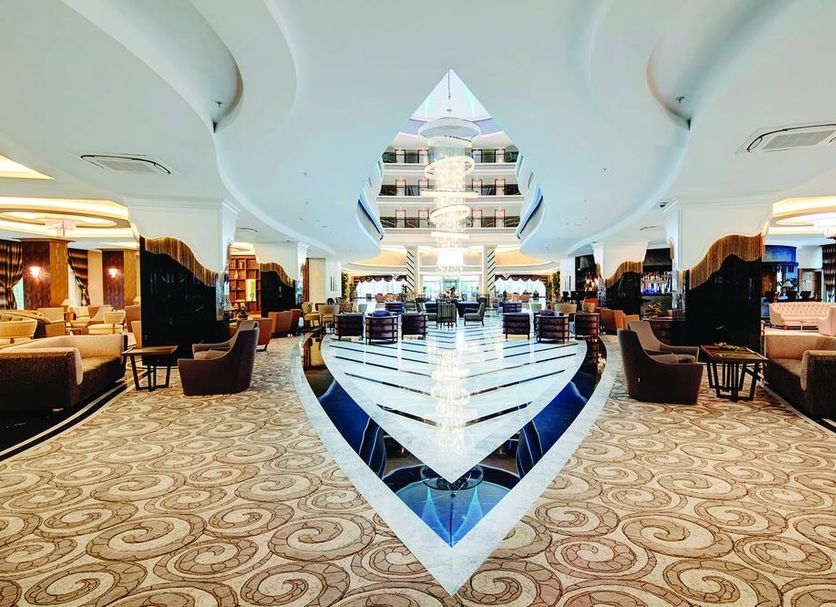 Tui Magic Life Jacaranda in Side lobby with central geometric atrium and lounge seating