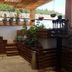 Hotel Temático Mision Colonial terrace with potted plants and wooden steps in San Cristóbal de las Casas