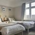 Gwyndra House B&B in St. Austell: twin room with two single beds and window light