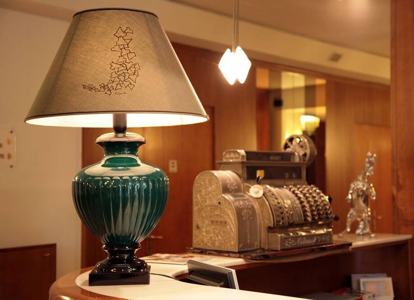 Hotel Bassetto in Ferentino lobby with decorative lamp and vintage cash register