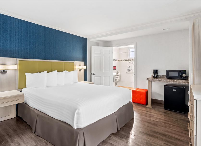 SureStay by Best Western Santa Monica guest room with king bed, desk, mini fridge and microwave