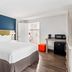 SureStay by Best Western Santa Monica guest room with king bed, desk, mini fridge and microwave