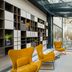Hotel Vision Budapest by Continental Group lobby with mustard lounge chairs and glass atrium in Budapest