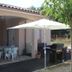 La Garona in Saint-Nicolas-de-la-Grave with patio seating and a shaded outdoor dining area