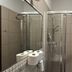 Aneks Kazimierz in Krakow bathroom with tiled walk-in shower and mirror above sink