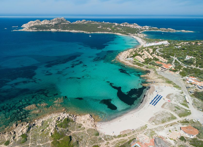 Mangia's Santa Teresa Sardinia, Curio Collection by Hilton overlooking turquoise bay and sandy beach in Santa Teresa Gallura