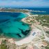 Mangia's Santa Teresa Sardinia, Curio Collection by Hilton overlooking turquoise bay and sandy beach in Santa Teresa Gallura