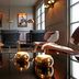 Stallmästaregården Hotel, Stockholm lounge with leather chairs, pendant lights and reflective table