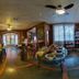 Aardvark Inn Pousada Gramado breakfast room with buffet table, bar seating and large windows