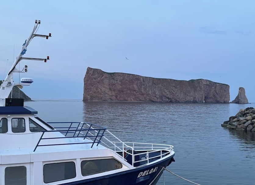Hotel-Motel Fleur de Lys in Perce with a boat and sea view of Percé Rock