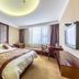 Hangzhou sailing International Hotel guest room in Hangzhou with king bed, desk and large window