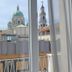 Flamingo B&B in Pompei with window view of cathedral domes and bell tower