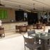 Asya Premier Suites in Boracay outdoor restaurant terrace with glass-top tables and woven chairs