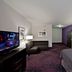 Holiday Inn Express & Suites Columbus - Polaris Parkway By IHG guest room with purple accent wall and TV