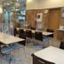Toyoko Inn Yamagata-eki Nishi-guchi breakfast dining area with tables, chairs, and clear acrylic partitions