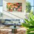 Séjours & Affaires Paris-Vitry lounge with sofa, plants, city views and colorful wall art in Vitry-sur-Seine