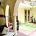 Riad Jardin Des Rêves in Marrakech courtyard with arches and a small pool