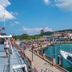 Chongkhao Resort, Ko Phi Phi: marina view with boats, pier, and waterfront walkway under blue sky