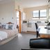 Tuki Tuki Motel in Waipukurau room with two beds, kitchenette and window view