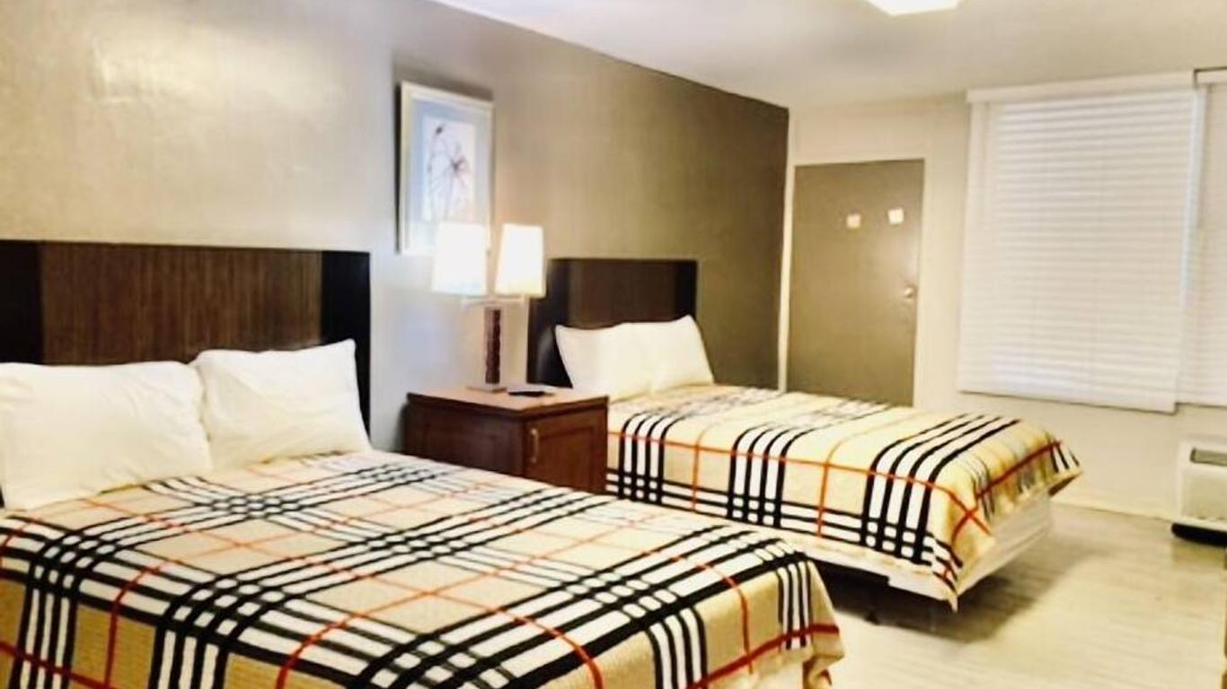 Apm Inn & Suites