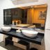 Illusion Xpress I Attraction Hotel Deluxe in Playa del Carmen bathroom with double sinks, glass shower and bed reflection