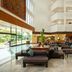 Centara Life Hotel Mae Sot lobby with seating area and tall atrium windows in Mae Sot