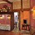 Hospedium Hacienda Las Cavas in Olmedo, rustic room with stone walls and a four-poster bed