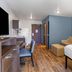 Extended Stay America Suites - Boston - Saugus room with bed, sofa and kitchenette in Saugus