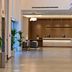 Clarion Hotel Jeddah Airport lobby in Jeddah with front desk, lounge chairs and modern lighting