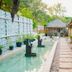 Les Villas Ottalia Yoga & Diving, Gili Meno: serene poolside walkway with thatched villas in Pemenang