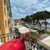 Hotel & Restaurant San Marco Ab terrace with lakefront view in Toscolano Maderno, flowers and umbrellas